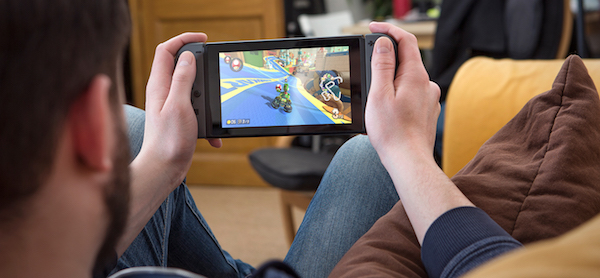 Playing Mario kart 8 Deluxe on Nintendo Switch in handheld mode