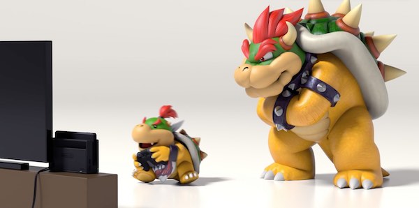 Bowser Jr plays Nintendo Switch with Bowser watching over him